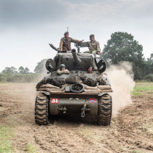 Sherman tank and crew leaving the arena at the Capel Military Show
