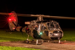 British Army Westland Scout helicopter XT826 idling at night with rotor light trails