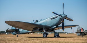 Supermarine Spitfire PL983 parked on the grass with other Spitfires in the background