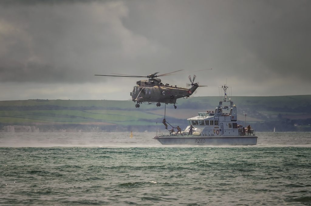 Westland Sea King Mk4 helicopter with Royal Navy patrol boat P280 HMS Dasher