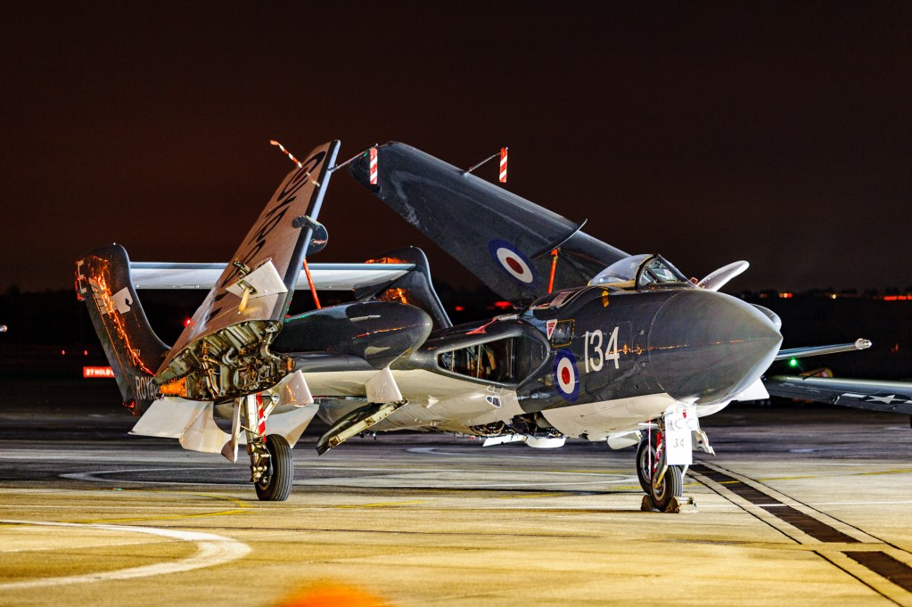 de Havilland Sea Vixen XP924 at night with wings folded and floodlit engine bay