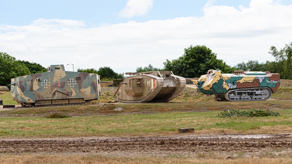 French Saint-Chamond, British Mark V and German A7V tanks lined up across the arena at Tankfest, Bovington